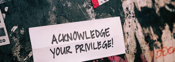 The words 'Acknowledge Your Privilege' are set against a black, white and red background.